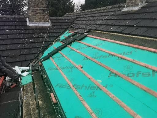 A roof stripped back with new breathable membrane and battens going on